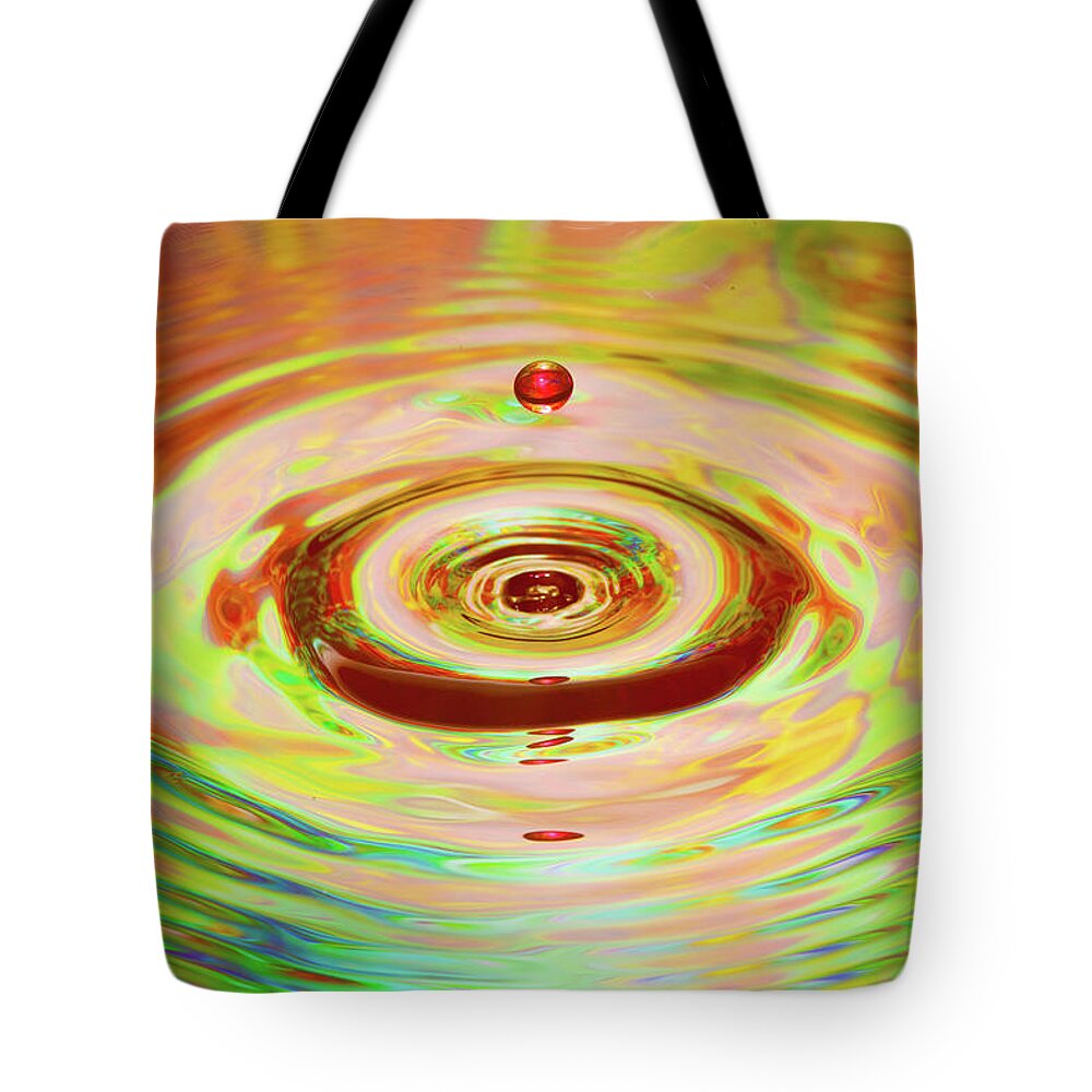 Water Tote Bag featuring the photograph Floating Water Droplet_6540 by Rocco Leone