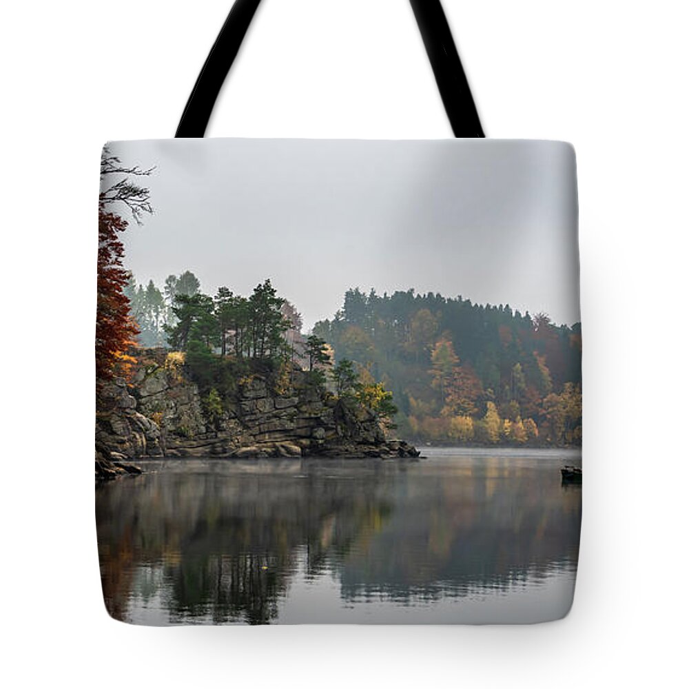 Austria Tote Bag featuring the photograph Foggy Landscape With Fishermans Boat On Calm Lake And Autumnal Forest At Lake Ottenstein In Austria by Andreas Berthold
