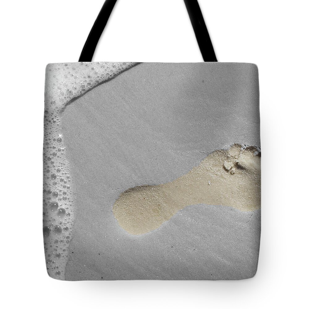 Footprint Tote Bag featuring the photograph Footprint by Dylan Punke