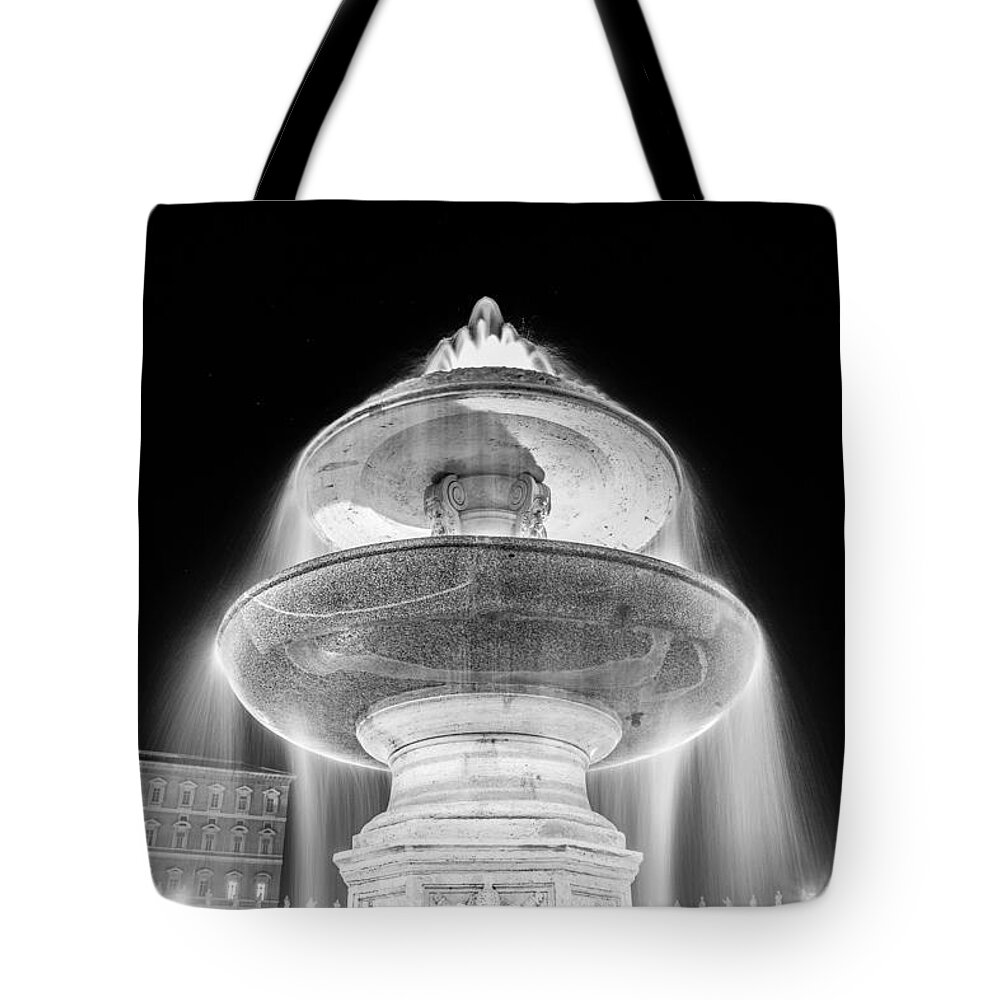 Night Tote Bag featuring the photograph Fountain at St. Peter's Square by night with starry sky by Fabiano Di Paolo