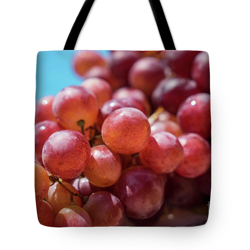 Red Tote Bag featuring the photograph Fresh Red Grapes In The Summer Sun by Adriana Mueller