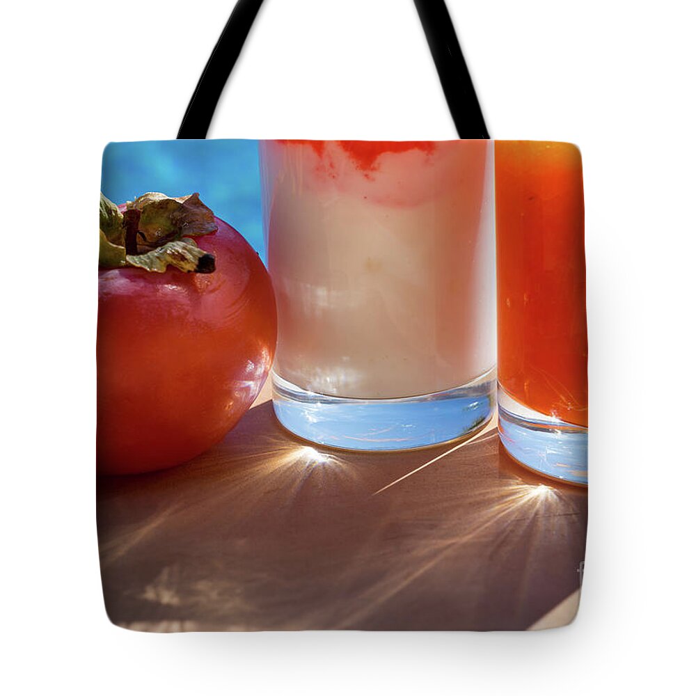 Sunlight Tote Bag featuring the photograph Fresh Sweet Persimmon And Delicious Drinks In The Summer Sun by Adriana Mueller