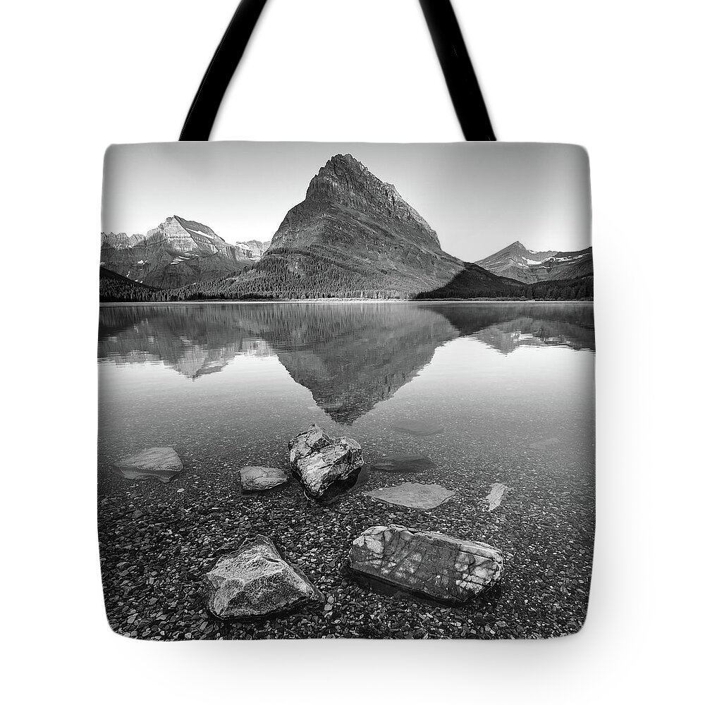 Reflections Tote Bag featuring the photograph Black and white reflections at Glacier National Park by Robert Miller
