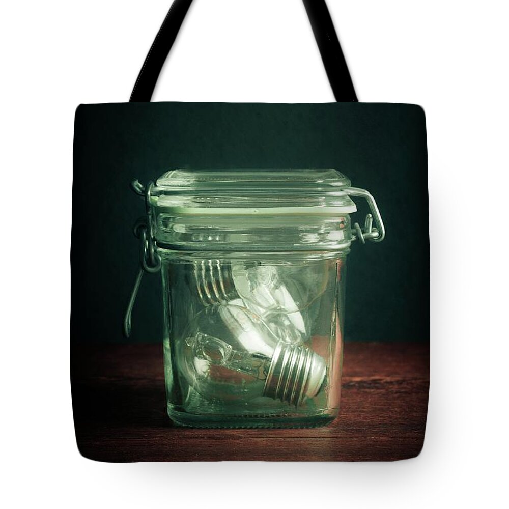 Jar Tote Bag featuring the photograph Glass Jar and Light Bulbs by Carlos Caetano