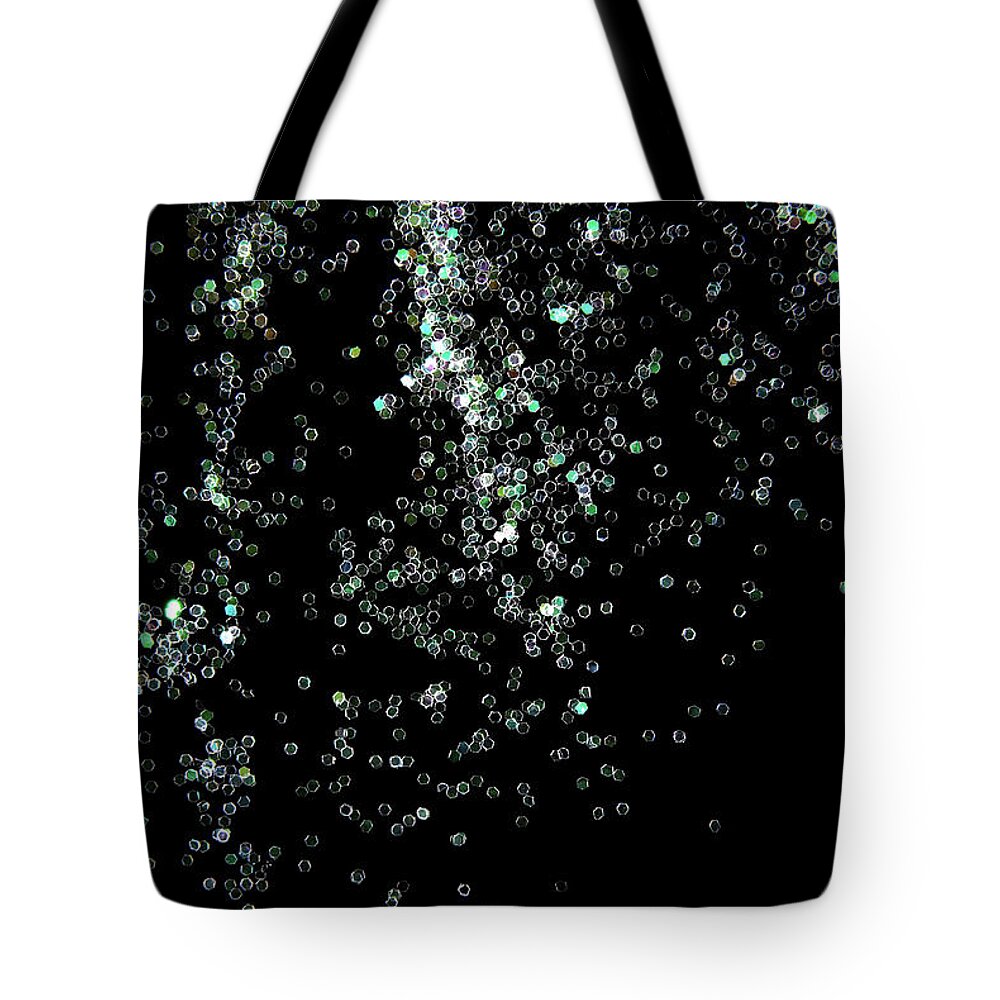 Background Tote Bag featuring the photograph Glitter Sparkle On Black Background by Severija Kirilovaite