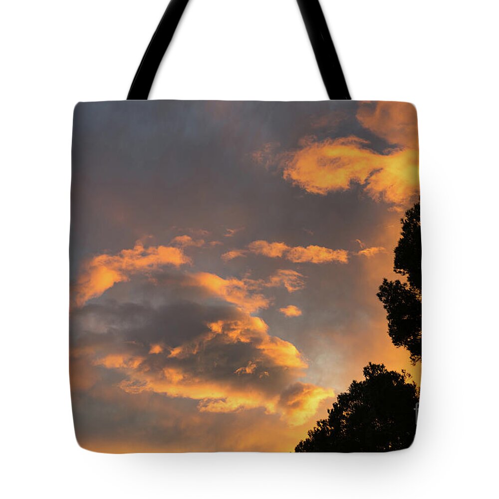 Clouds Tote Bag featuring the photograph Glowing sky by Adriana Mueller