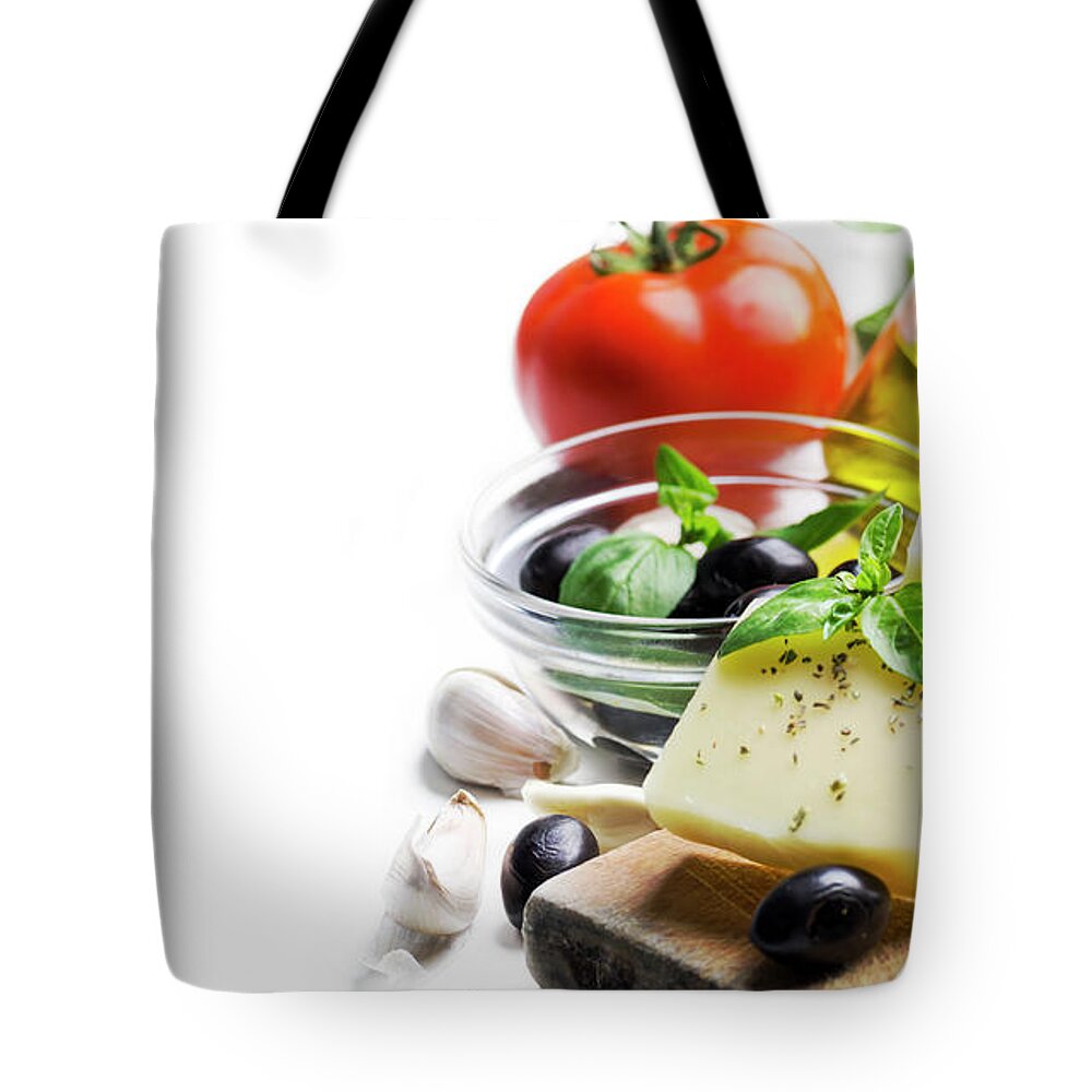 Cheese Tote Bag featuring the photograph Goat cheese, olives, olive oil, tomato, garlic, basil and spices by Jelena Jovanovic