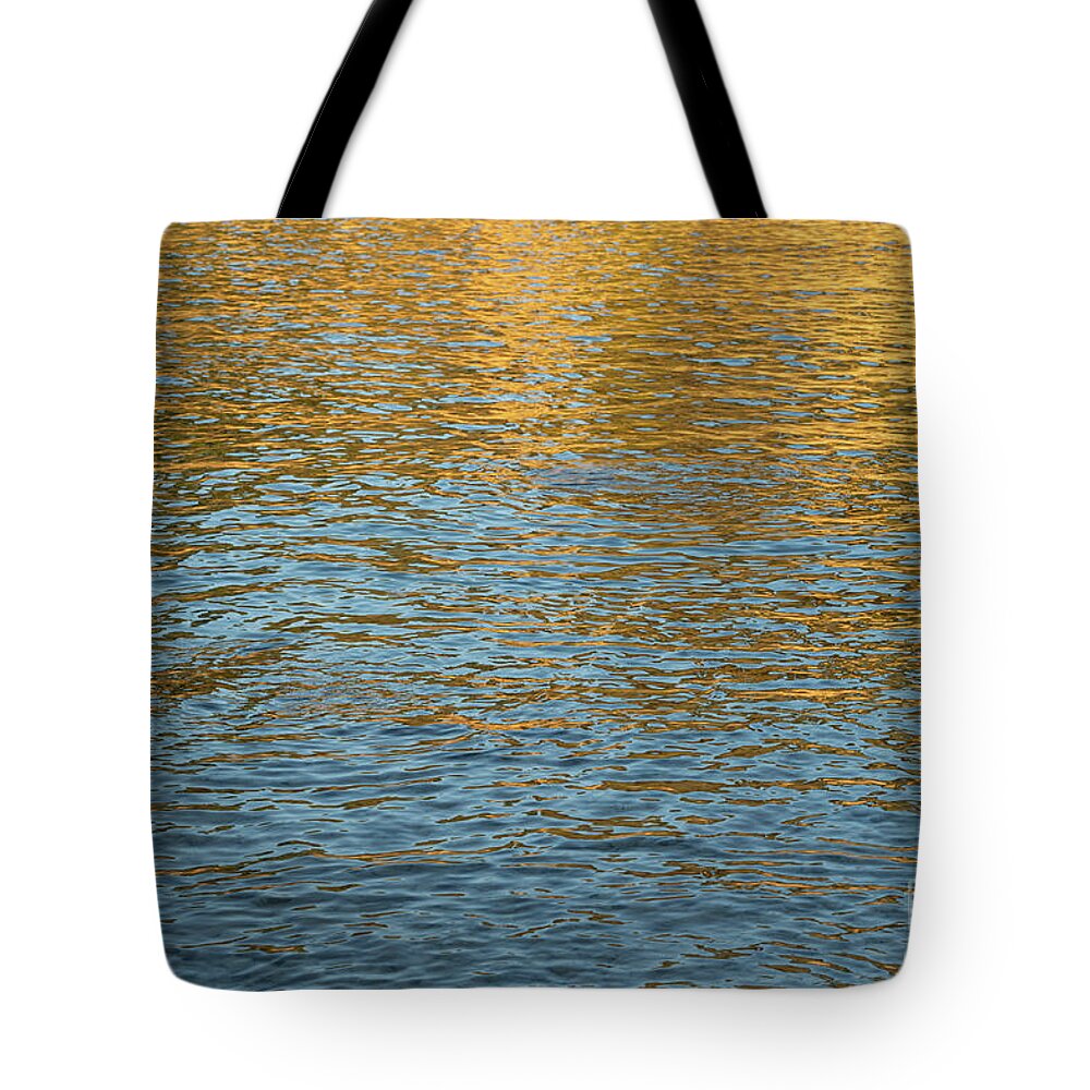 Mediterranean Sea Tote Bag featuring the photograph Golden and blue water surface at sunrise. Mediterranean Sea by Adriana Mueller