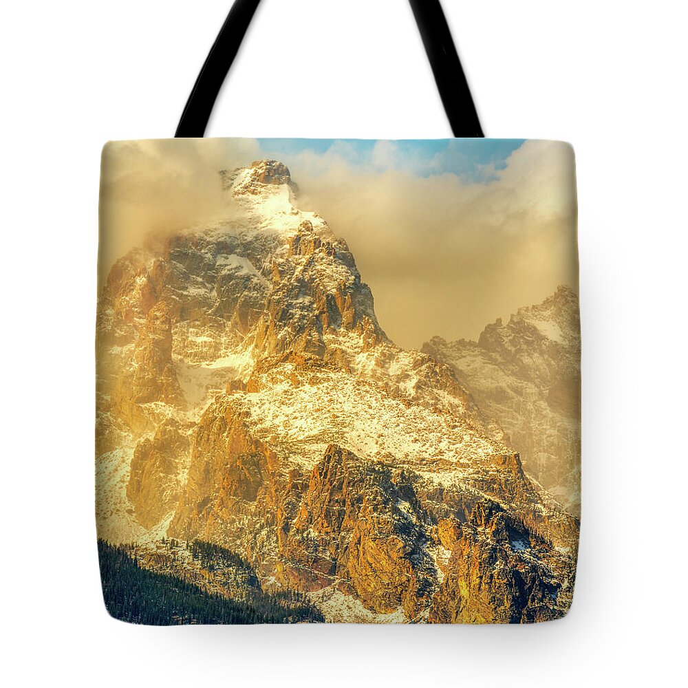Grand Tote Bag featuring the photograph Grand Tetons Draped in Clouds by Kenneth Everett