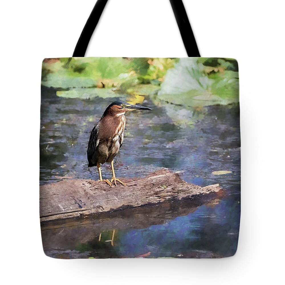 Green Heron Tote Bag featuring the photograph Green Heron with a Painterly Background of Water Lilies by Belinda Greb