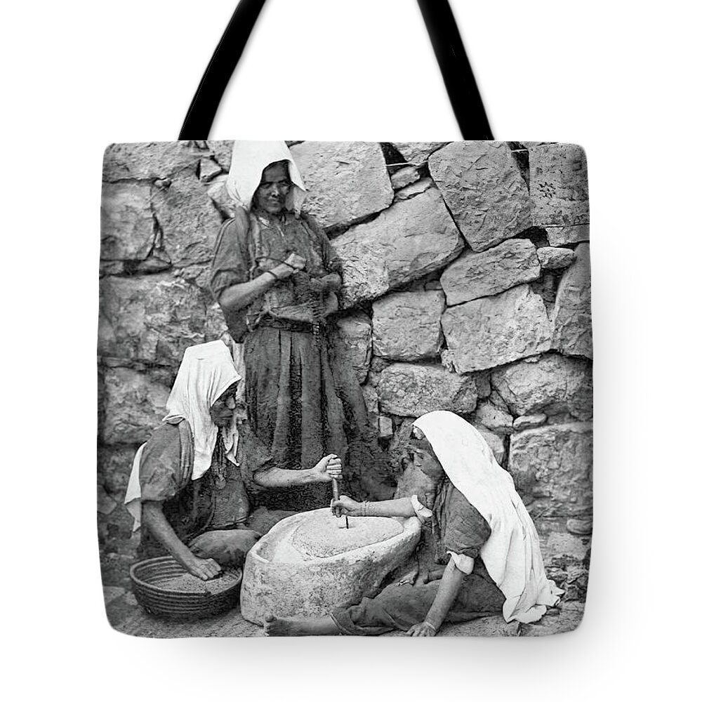 Women Tote Bag featuring the photograph Grinding in Bethlehem in 1917 by Munir Alawi