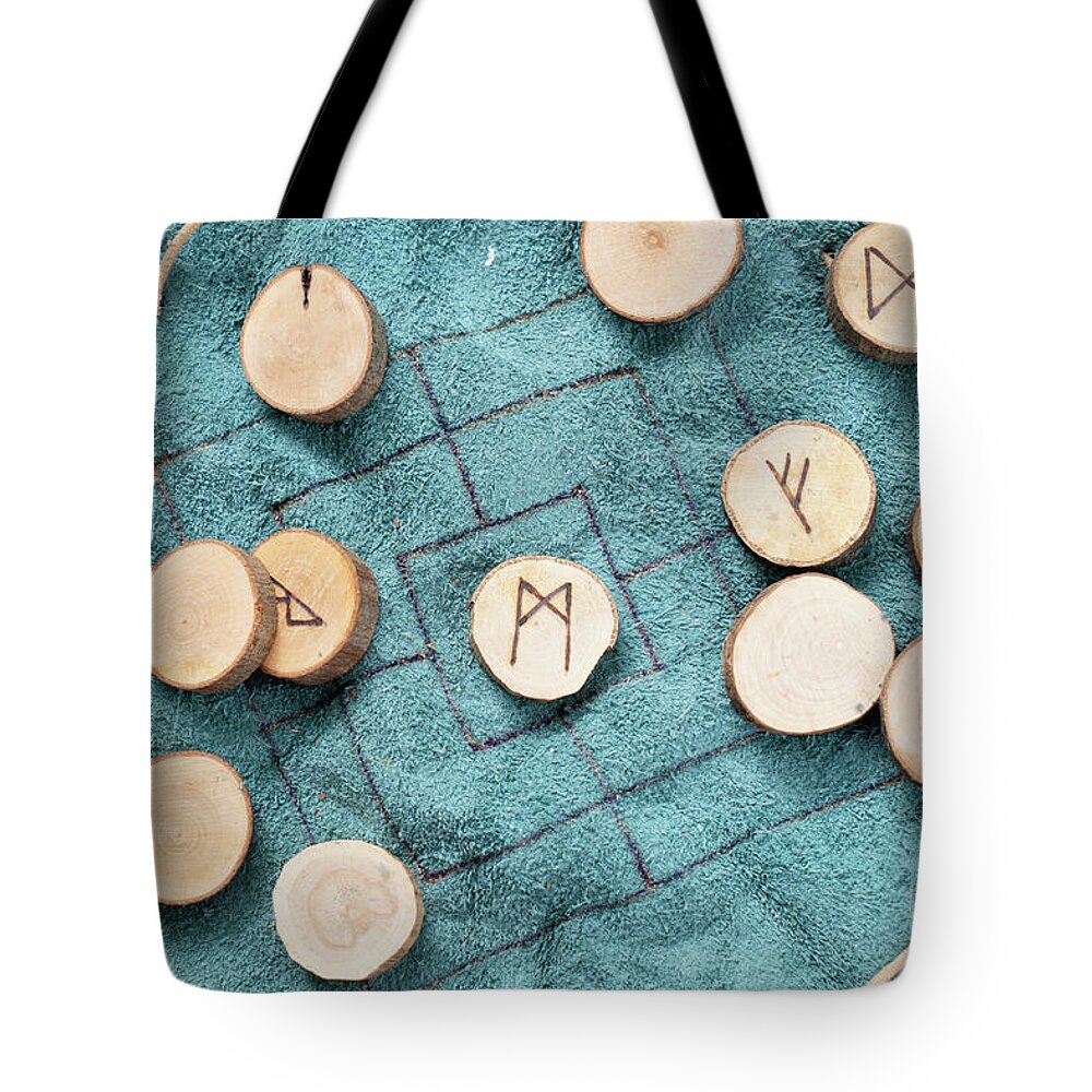Runes Tote Bag featuring the photograph Handmade runes for fortunetelling by Anastasy Yarmolovich