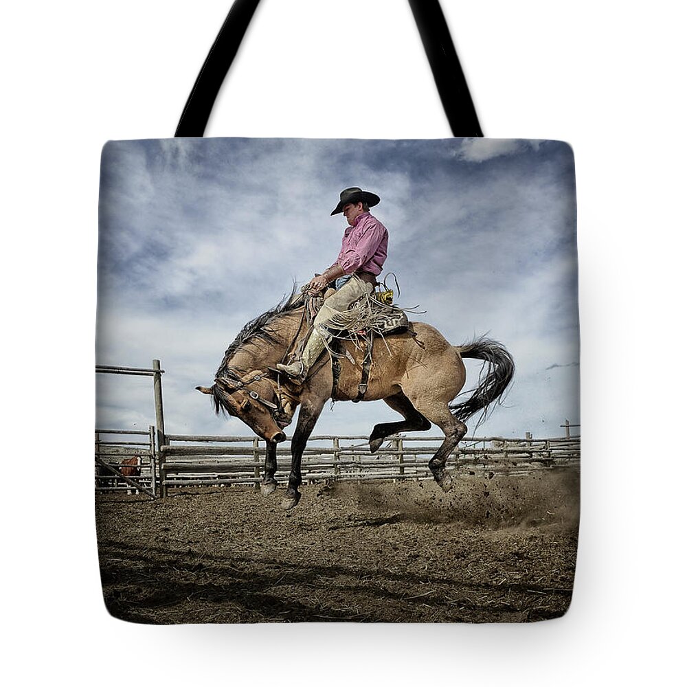 Cowboy Tote Bag featuring the photograph Hang Tough by Phyllis Burchett