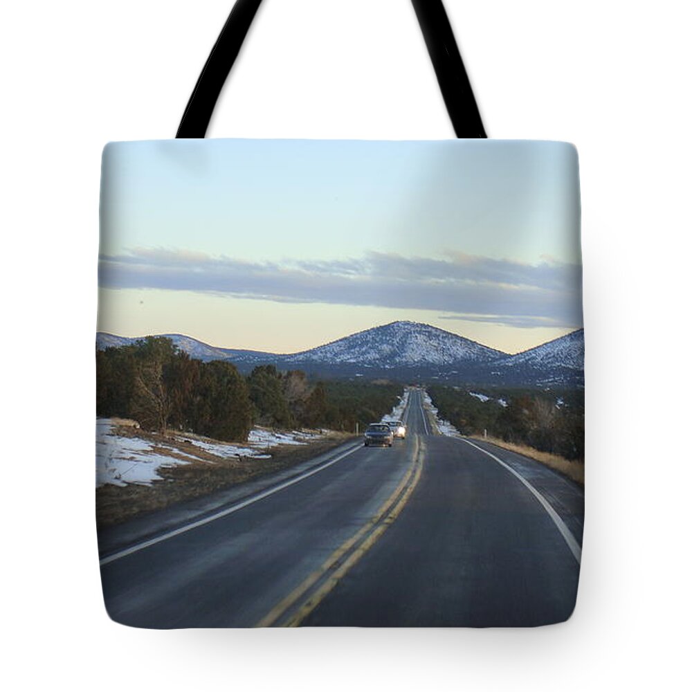  Tote Bag featuring the photograph Highbeam by Trevor A Smith