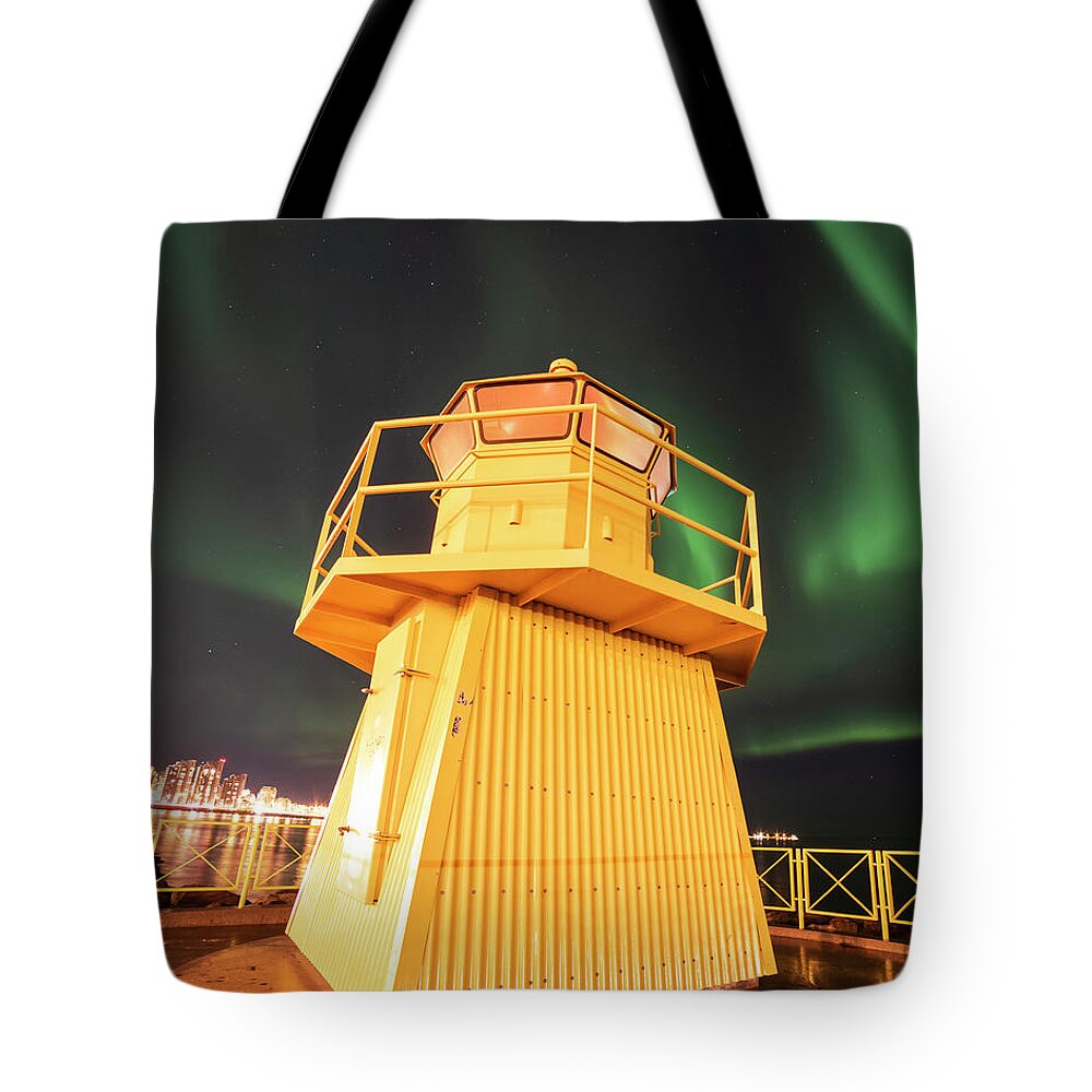Höfði Tote Bag featuring the photograph Hofoi lighthouse Northern Lights on the Reykjavik Waterfront Iceland Streak by Toby McGuire