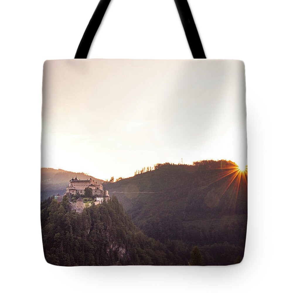 Reconstruction Tote Bag featuring the photograph Hohenwerfen Castle at sunset by Vaclav Sonnek