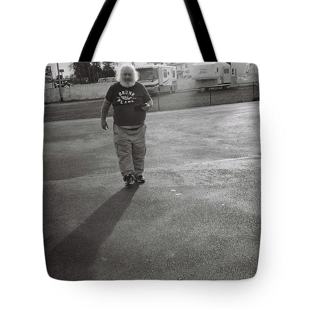 Street Photography Tote Bag featuring the photograph Hurried Glow by Chriss Pagani