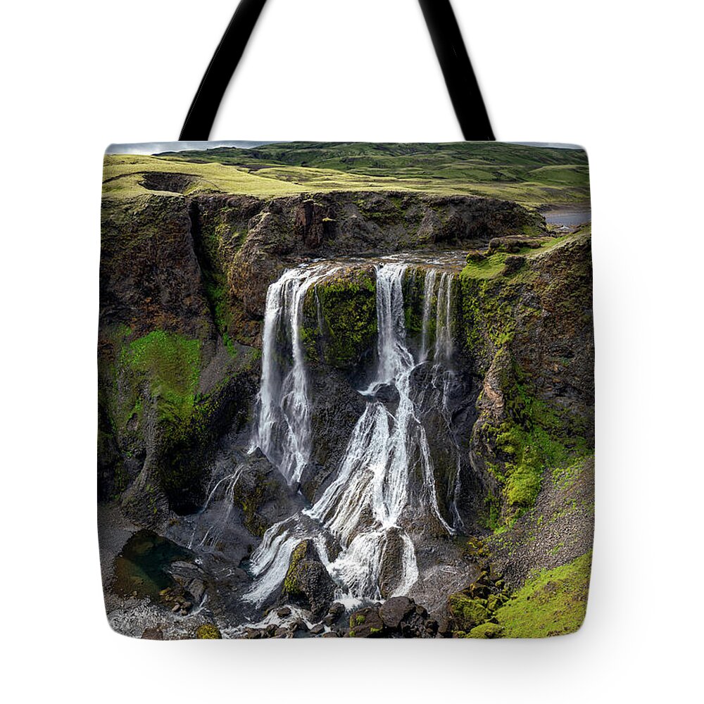 Fagrifoss Tote Bag featuring the photograph Iceland - Fagrifoss waterfall near the Lakagigar region by Olivier Parent