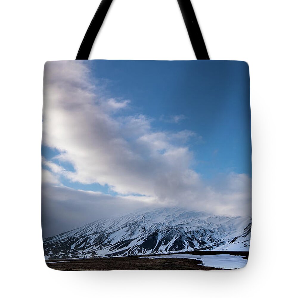 Iceland Tote Bag featuring the photograph Icelandic landscape with mountains covered in snow at snaefellsnes peninsula in Iceland by Michalakis Ppalis
