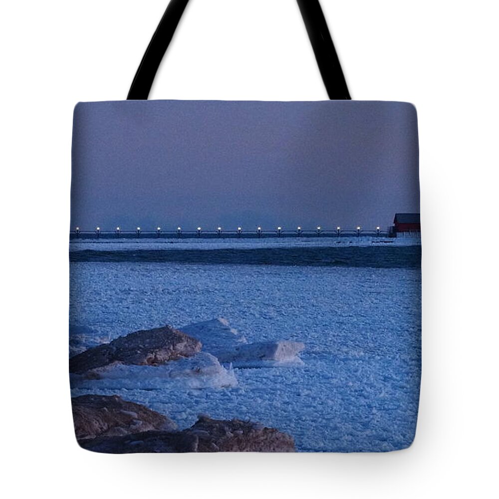 Grand Haven South Pierhead Outer Lighthouse Tote Bag featuring the photograph Icy Lights of the Grand Haven South Pierhead Outer Lighthouse by Tony Lee