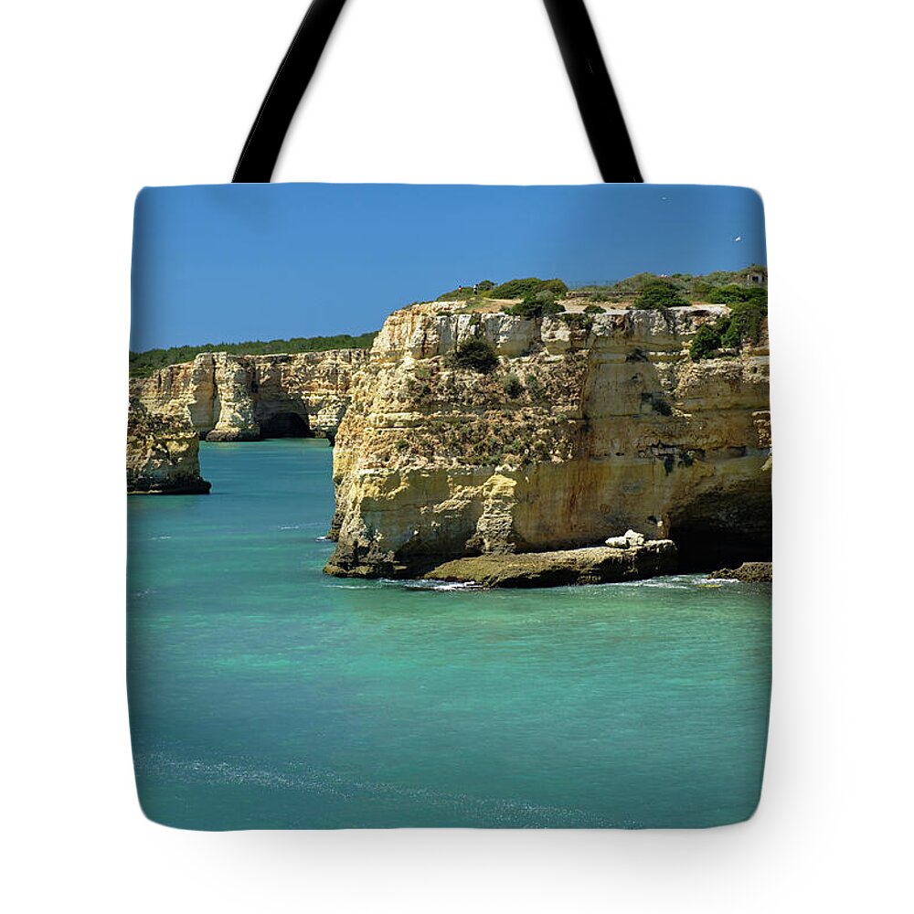 Algarve Sea Tote Bag featuring the photograph Idyllic sea and cliff scenery by Angelo DeVal