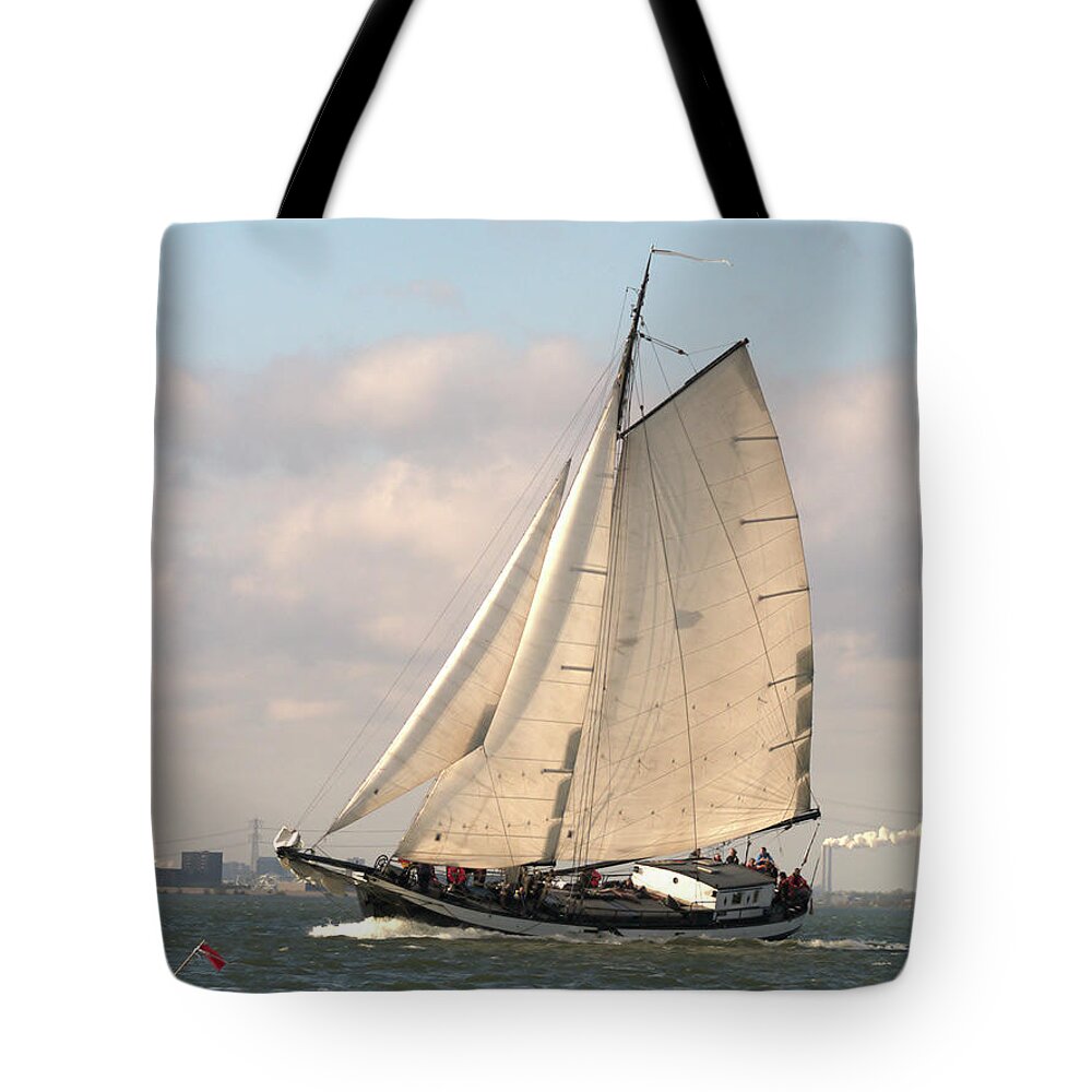 Digital Phhotography Tote Bag featuring the photograph In the Race by Luc Van de Steeg