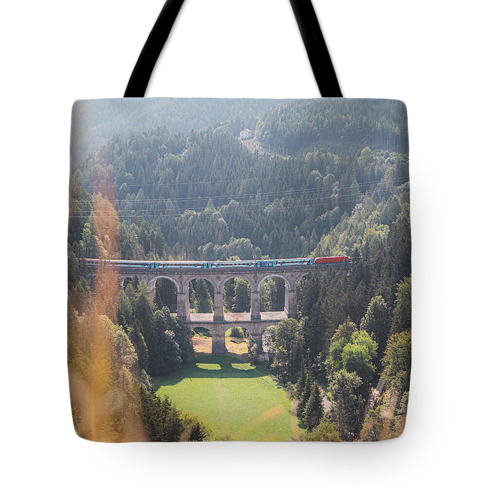 Semmering Tote Bag featuring the photograph Kalte Rinne railway viaduct and a passing train in Semmering, Austria by Vaclav Sonnek