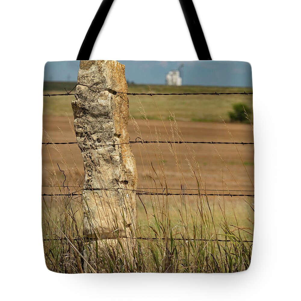 Kansas Tote Bag featuring the photograph Kansas Rock Posts and grain elevators by Garry McMichael