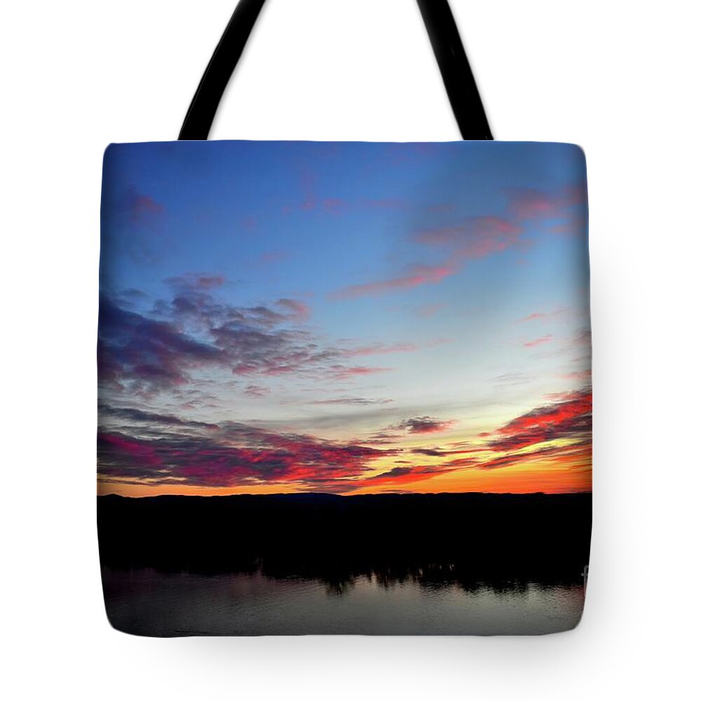 Nature Tote Bag featuring the photograph Kissing The Sunset Clouds by Leonida Arte