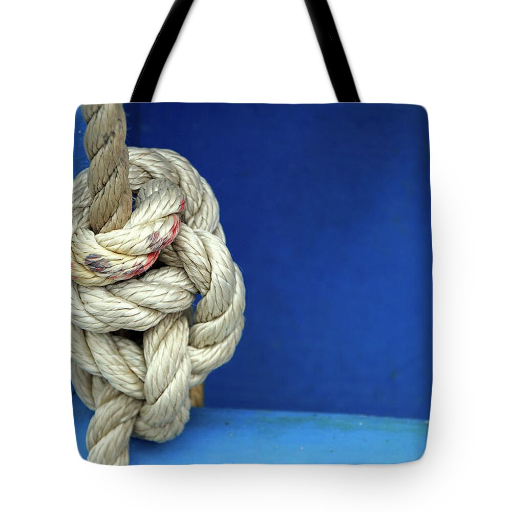 Rope Tote Bag featuring the photograph Knot on a rope by Fabiano Di Paolo