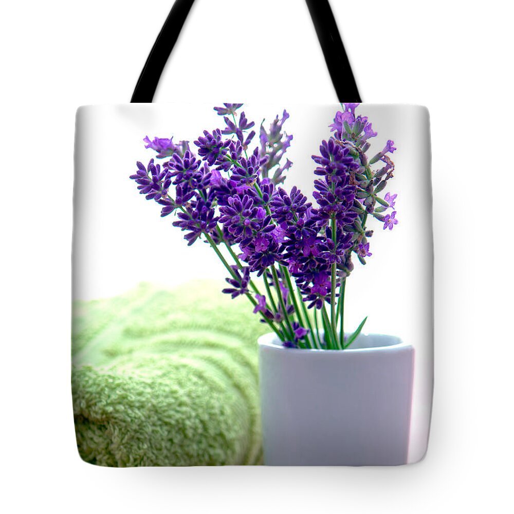 Aromatherapy Tote Bag featuring the photograph Lavender Flowers and Bath Towel in a Spa by Olivier Le Queinec