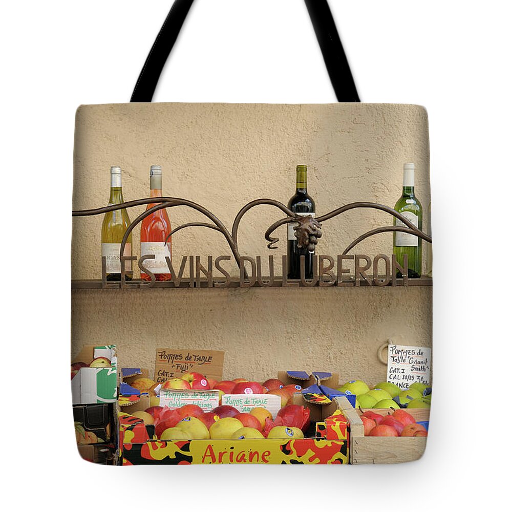 Market Tote Bag featuring the photograph Les Vins Du Luberon store sign with wine bottles and fresh fruit, Lourmarin, France by Kevin Oke