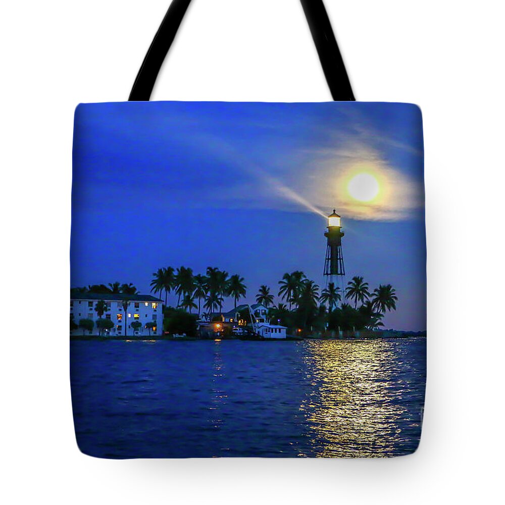Lighthouse Tote Bag featuring the photograph Light Beams and Moonrise by Tom Claud