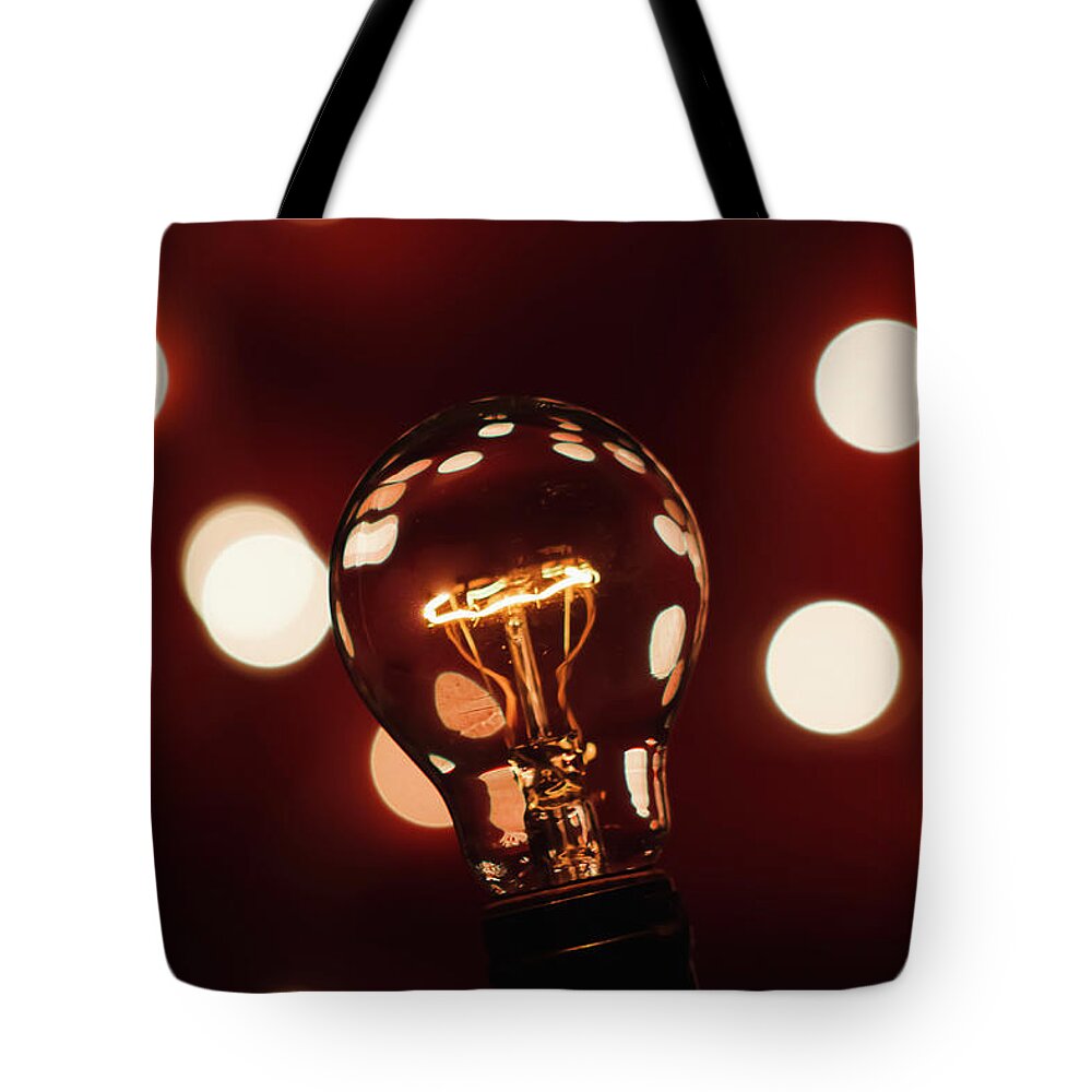 Light Bulb Tote Bag featuring the photograph Light Bulb Bokeh by Gary Geddes
