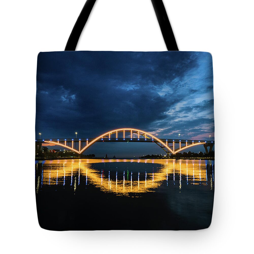 Port Of Milwaukee Tote Bag featuring the photograph Light the Hoan in Blue and Gold by Kristine Hinrichs
