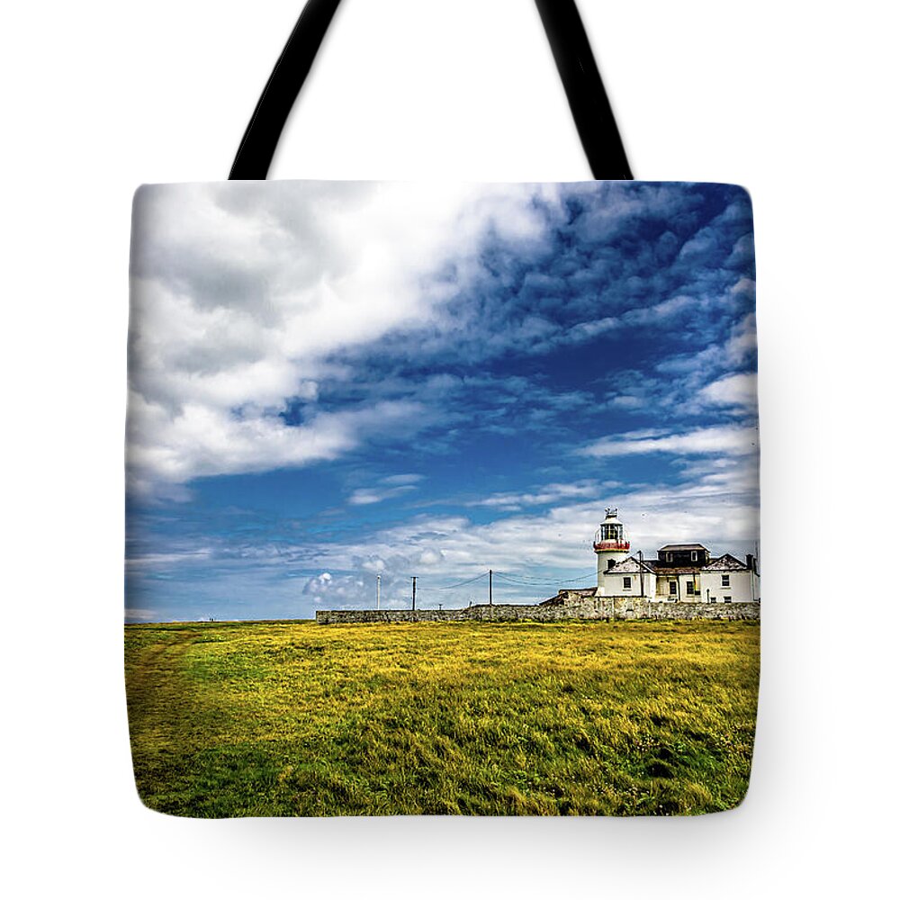 Ireland Tote Bag featuring the photograph Lighthouse On Loop Head Peninsula In Ireland by Andreas Berthold