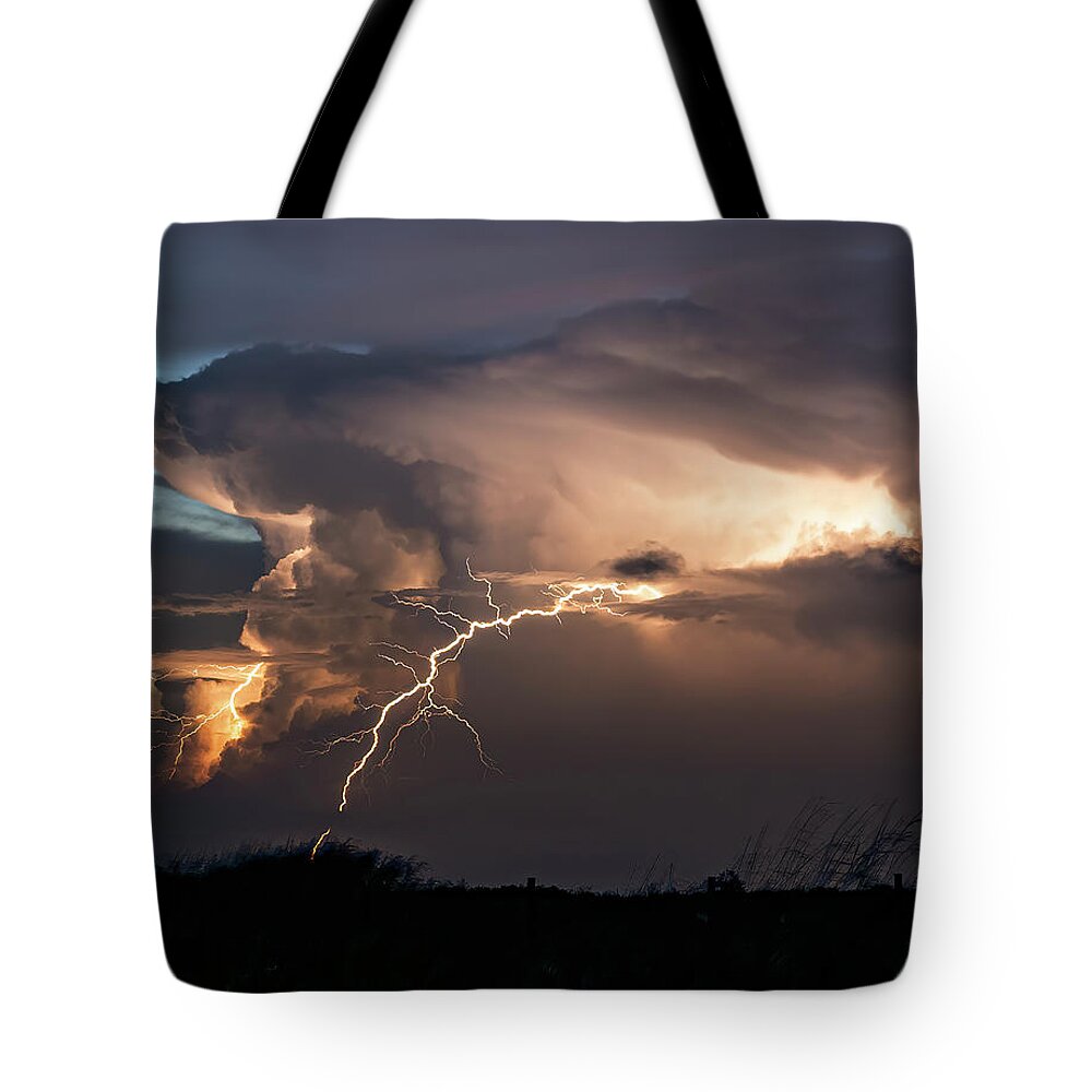 Storm Tote Bag featuring the photograph Lighting the Evening Sky by Jerry Connally