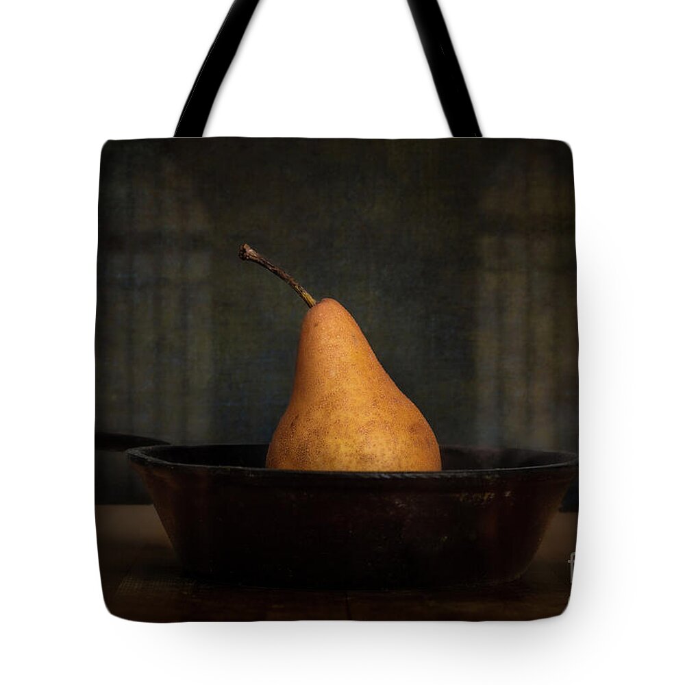Still Life Tote Bag featuring the photograph Lone Pear in Cast Iron 1 by Jarrod Erbe