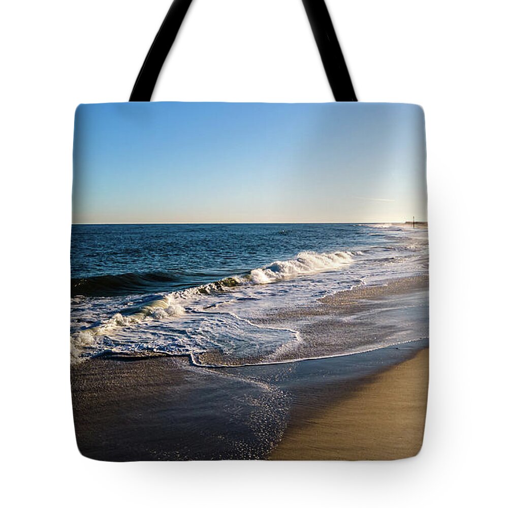 New Jersey Tote Bag featuring the photograph Lone Person on the Beach by Louis Dallara