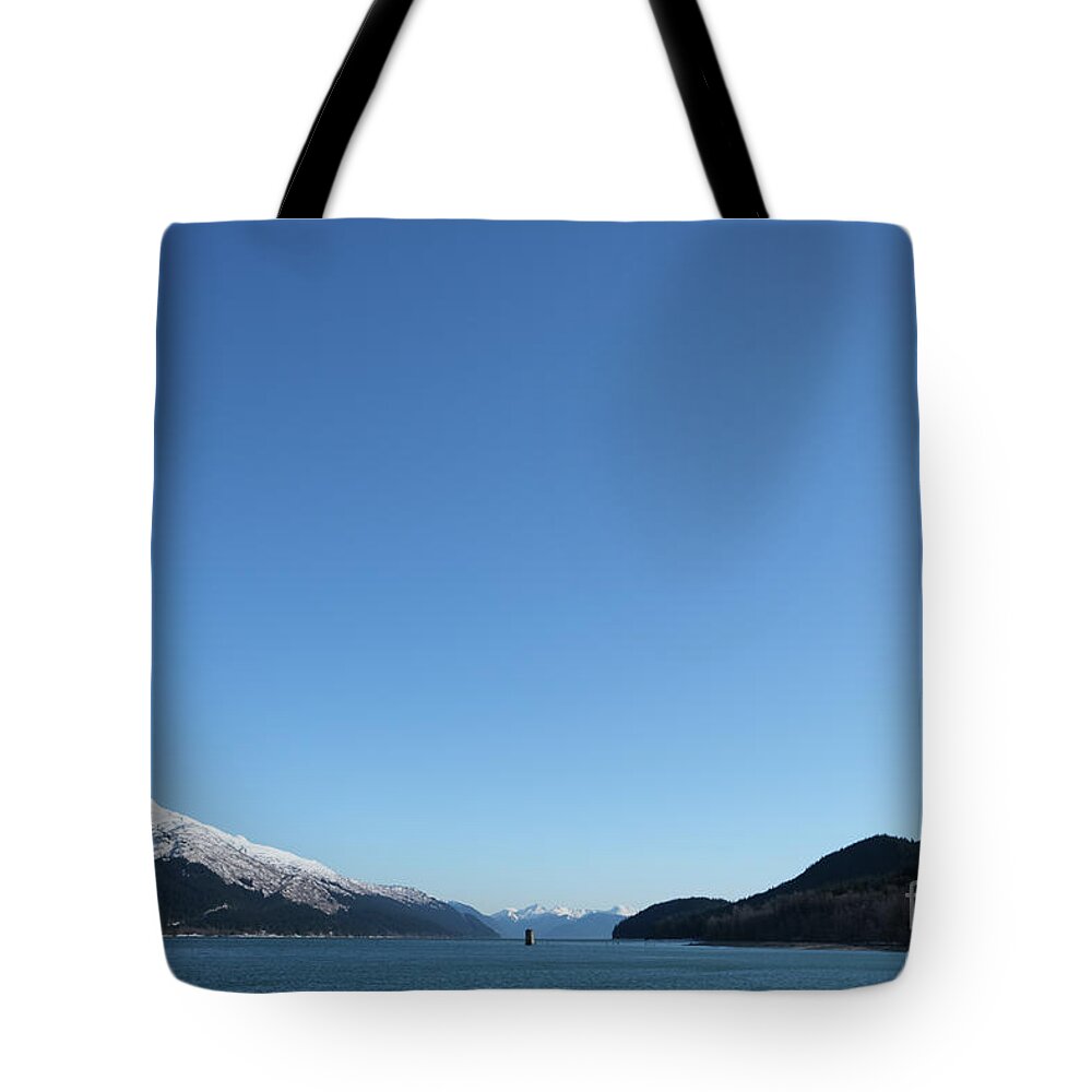 #juneau #alaska #ak #douglas #pumphouse #lynncanal #cruise #tours #bluesky #vacation #peaceful #savikkopark #treadwellmine #mining Tote Bag featuring the photograph Lonely Sentinel by Charles Vice