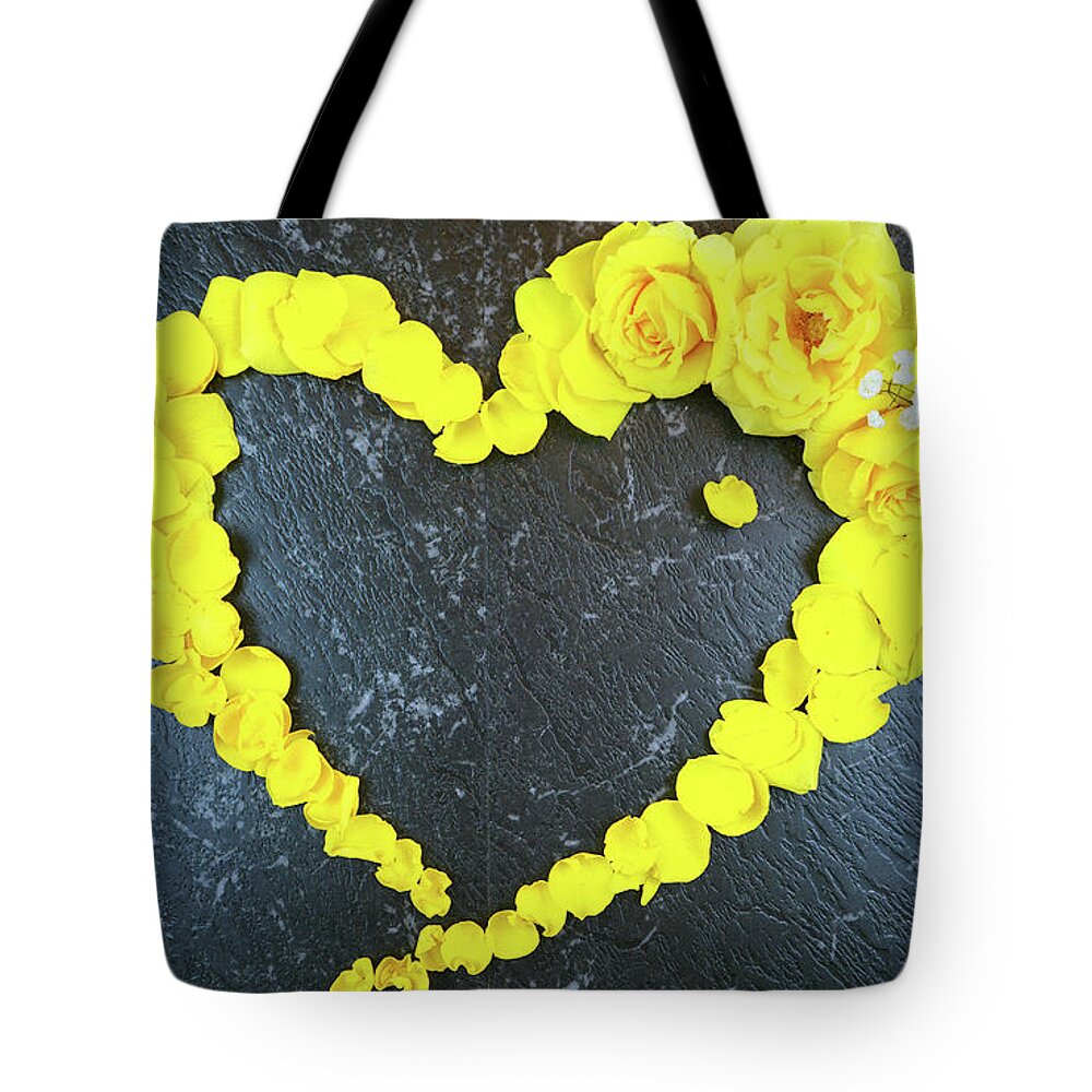 Yellow Tote Bag featuring the photograph Love heart border made from fresh yellow roses and petals by Milleflore Images