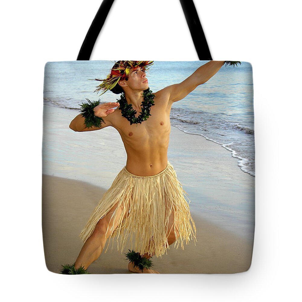 Beach Tote Bag featuring the photograph Male Hula Dancer performing on the sand by Gunther Allen