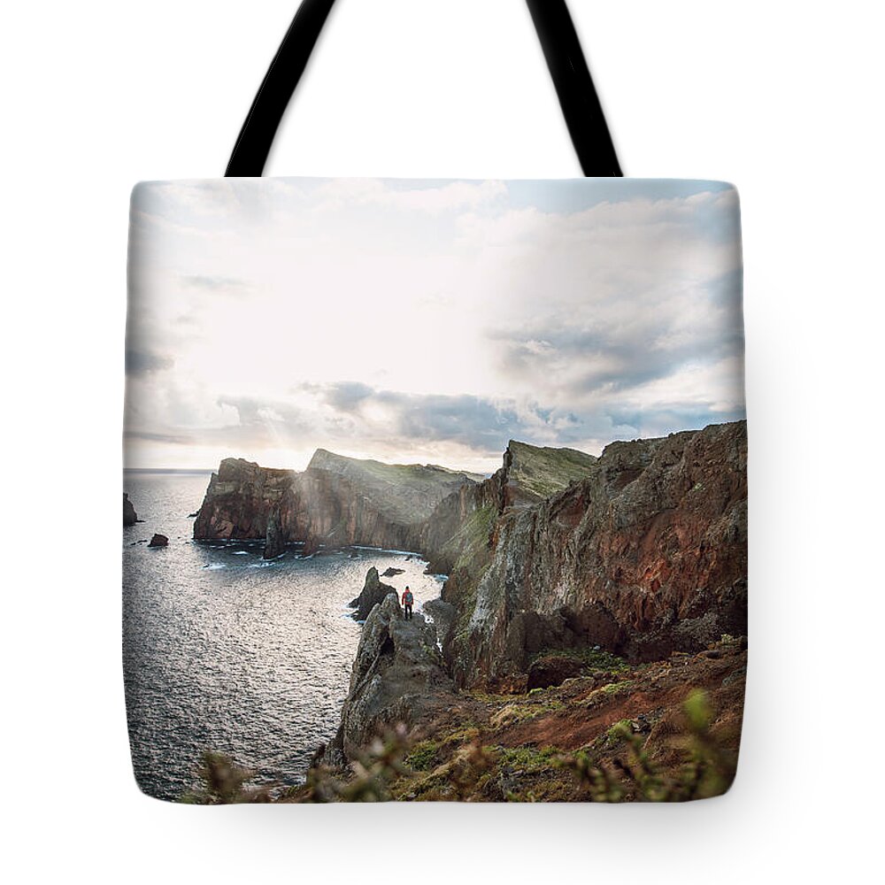 Ponta De Sao Lourenco Tote Bag featuring the photograph Man watching the dawn of a new day by Vaclav Sonnek