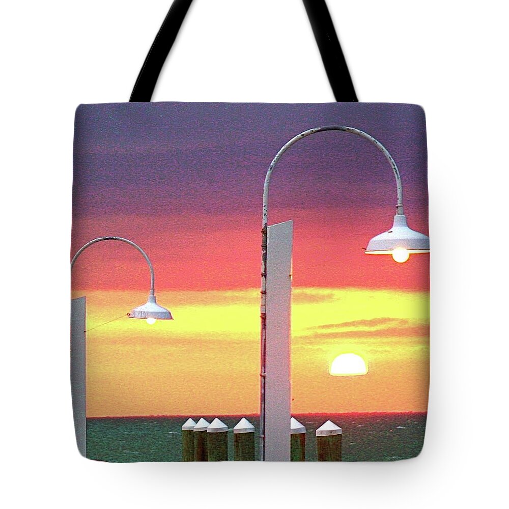 Sunset Tote Bag featuring the photograph Manmade and Heavenly Light by Dorsey Northrup