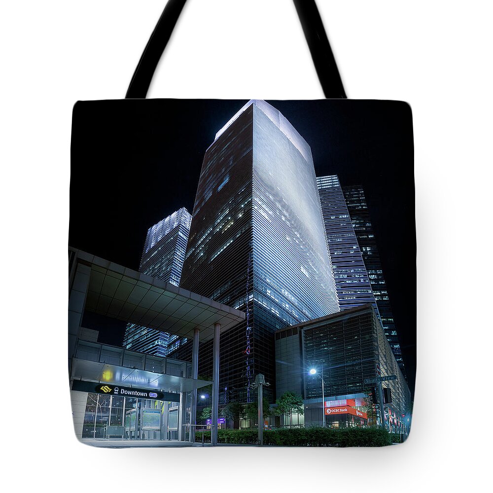 Night Tote Bag featuring the photograph Marina Bay Financial Centre by Rick Deacon