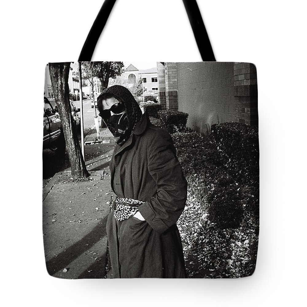Street Photography Tote Bag featuring the photograph Masked by Chriss Pagani