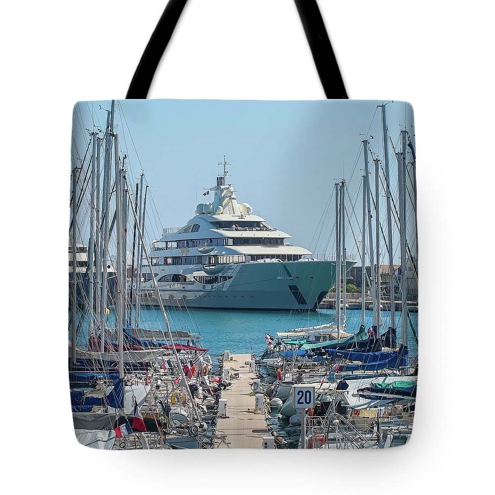 Alpes Mari Tote Bag featuring the photograph Mega yacht in Antibes by Jean-Luc Farges