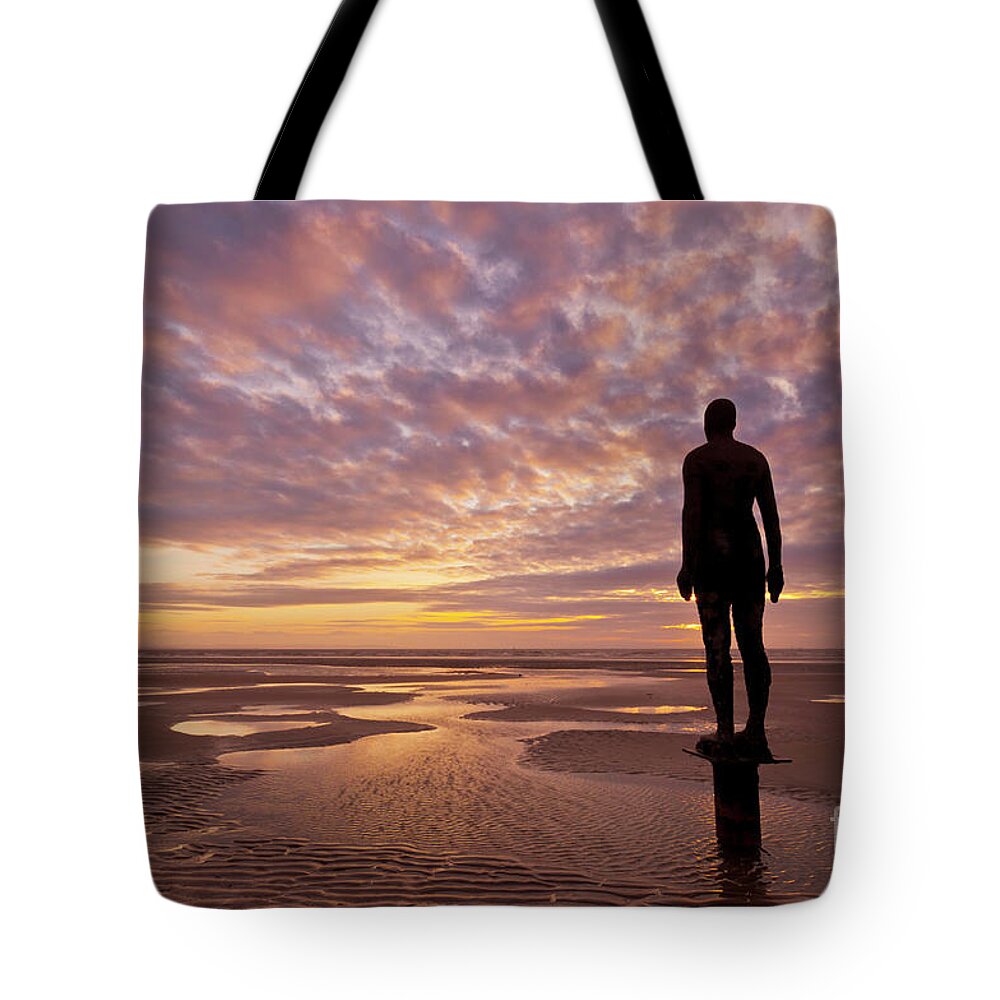 Another Place Tote Bag featuring the photograph Metal statues on Crosby beach, Merseyside, England by Neale And Judith Clark