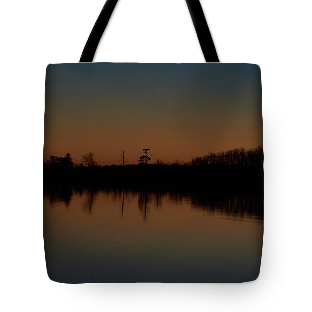 Sunset Tote Bag featuring the photograph Moody sunset by Paul Freidlund