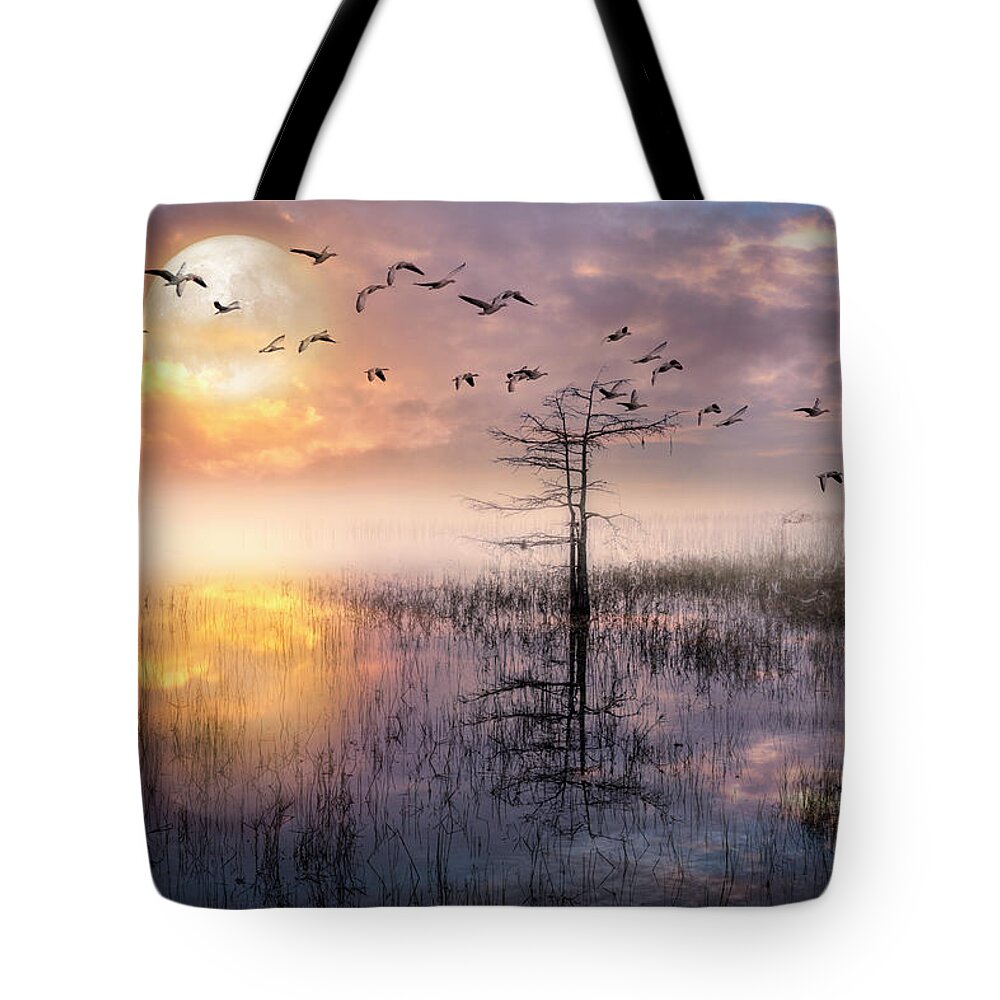Birds Tote Bag featuring the photograph Moon Rise Flight by Debra and Dave Vanderlaan